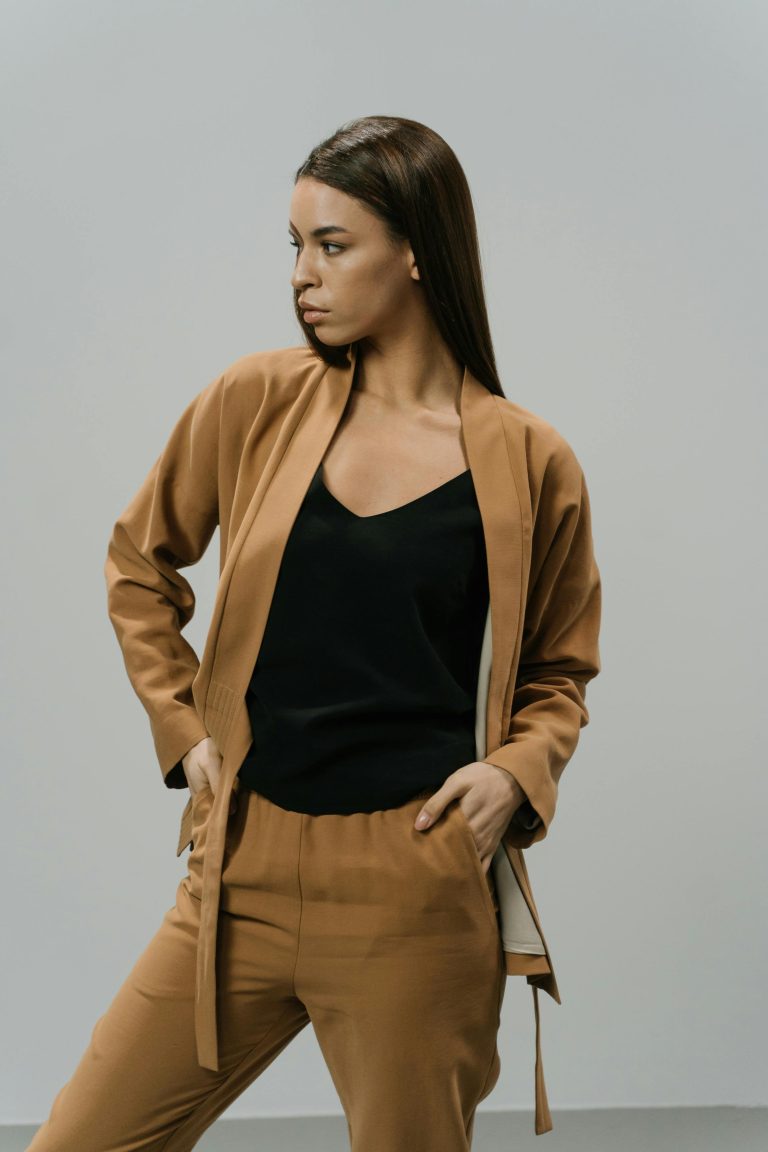 Woman wearing camel tailored pants and matching jacket
