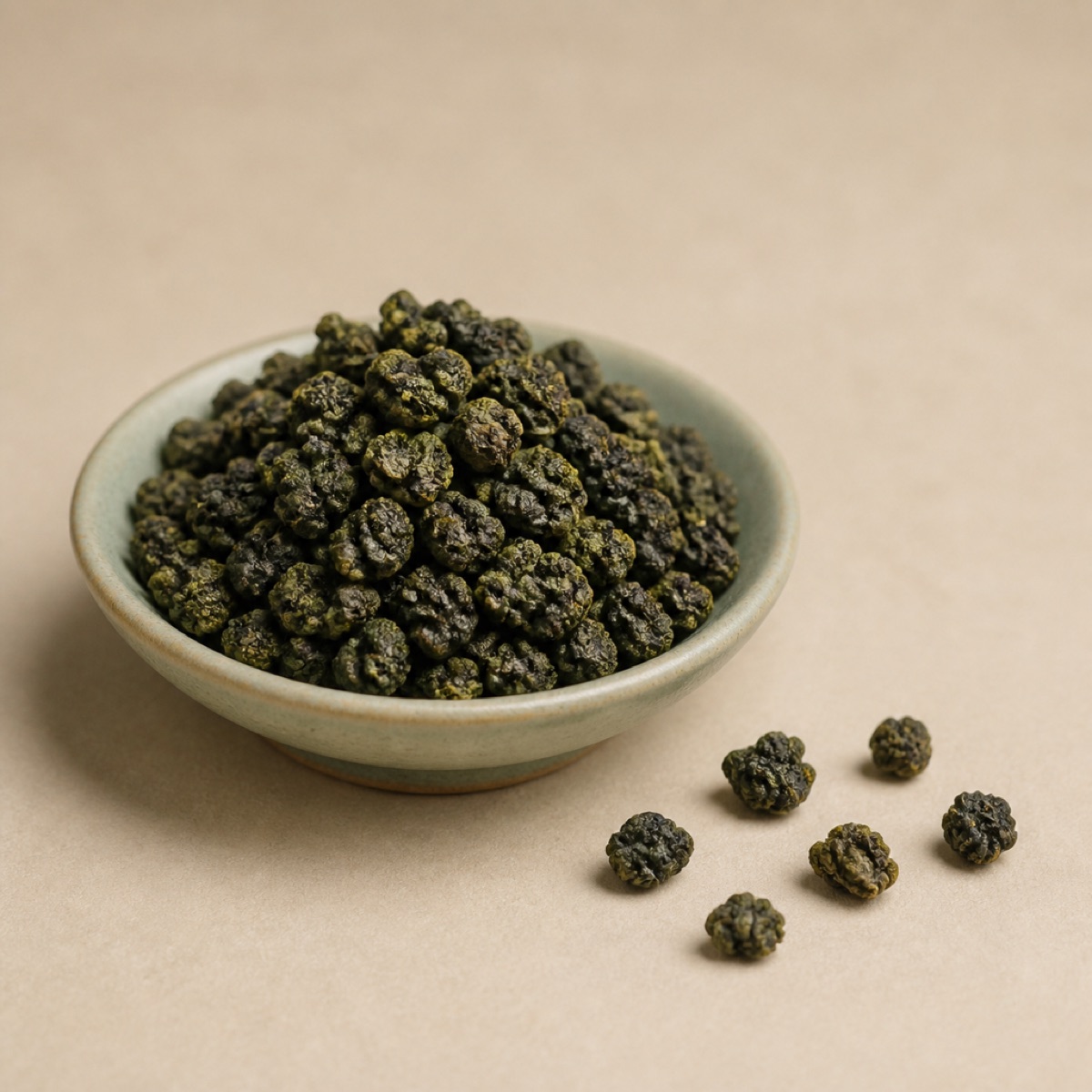 Loose leaf tea resting in a shallow ceramic dish on linen