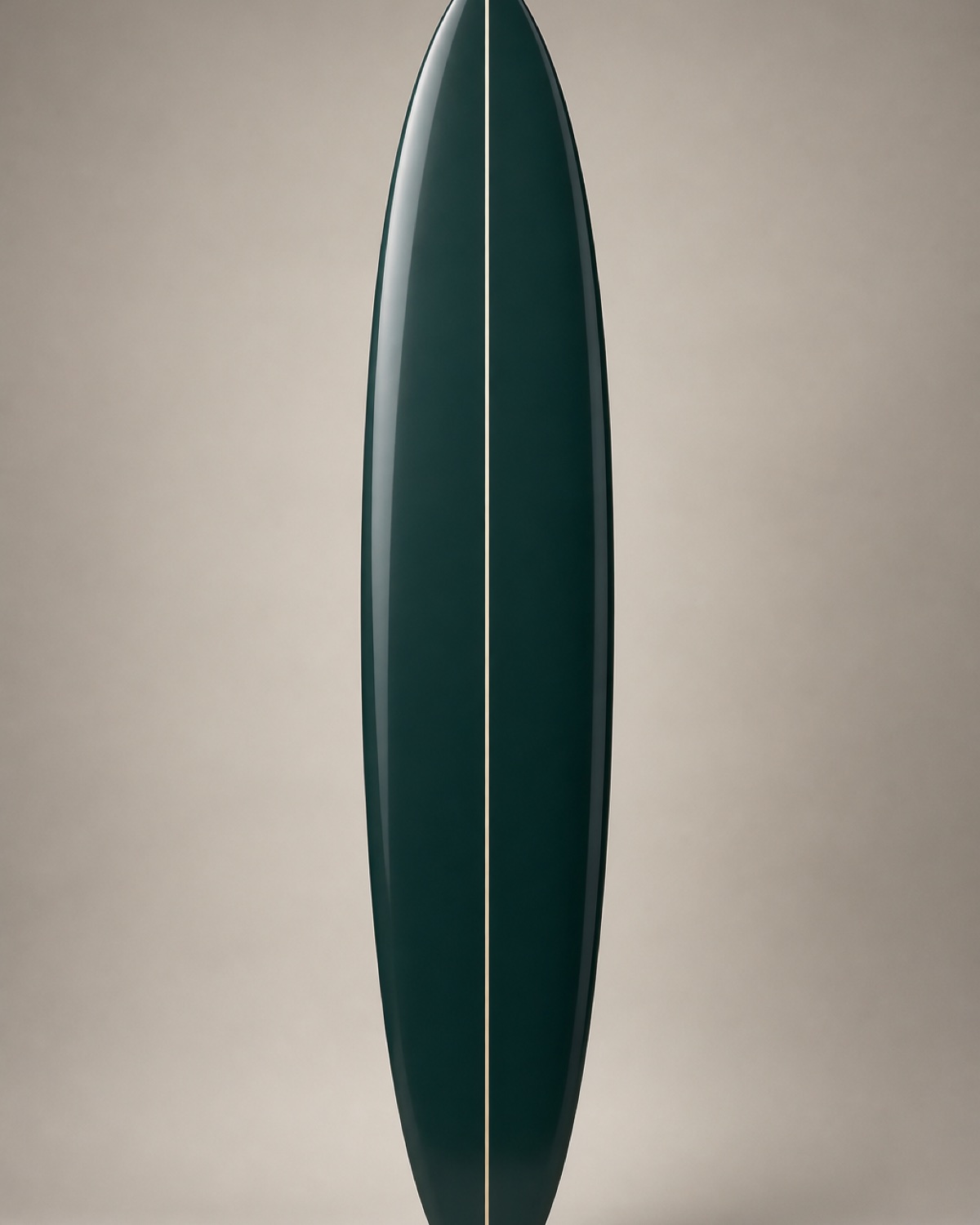 A slim charcoal-teal step-up surfboard with a round pin tail