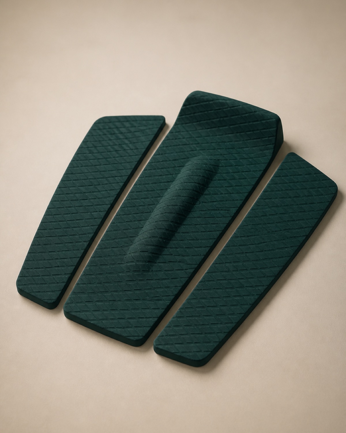 A three-piece deep teal EVA traction pad with an arch bar