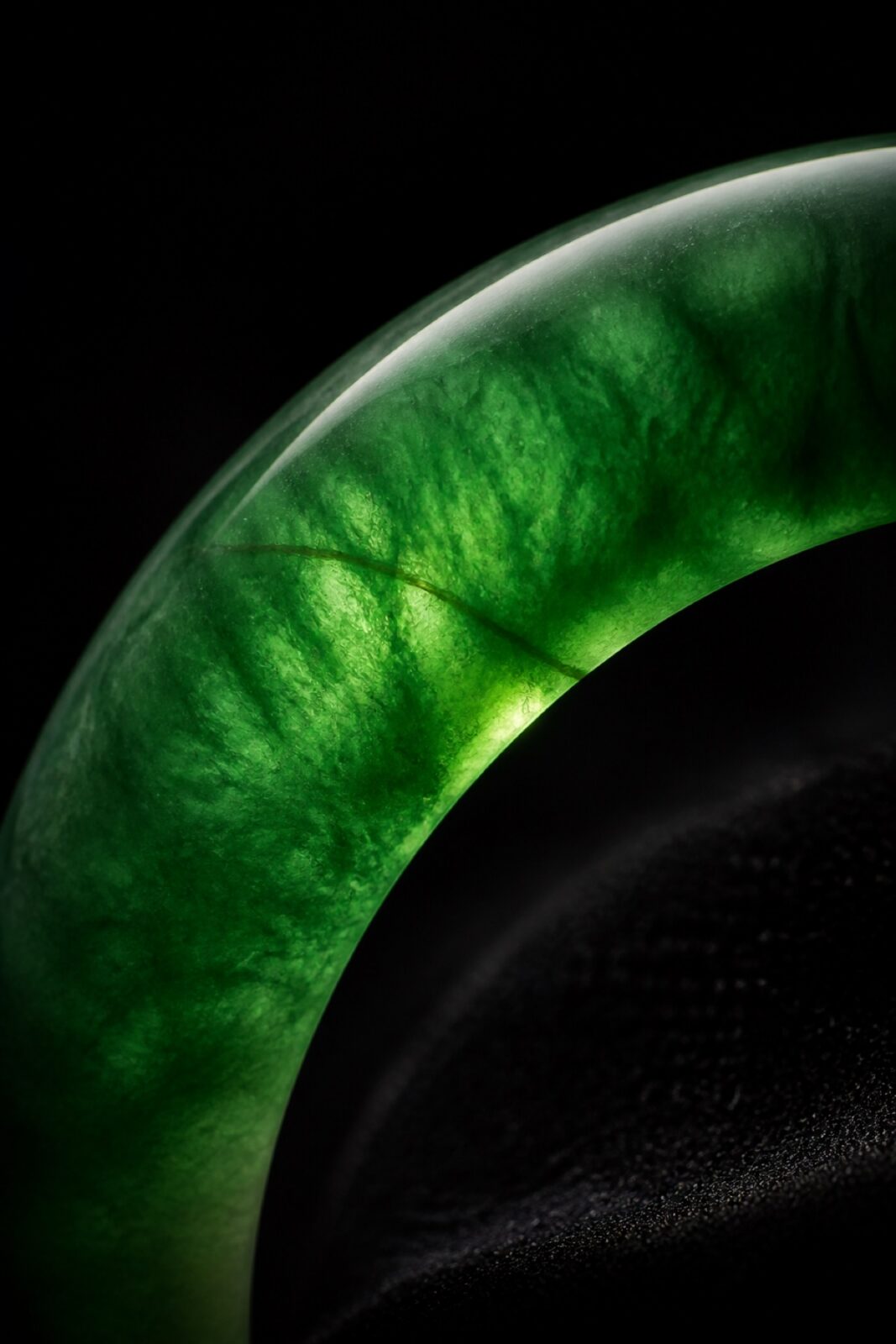Imperial green jadeite bangle on black velvet