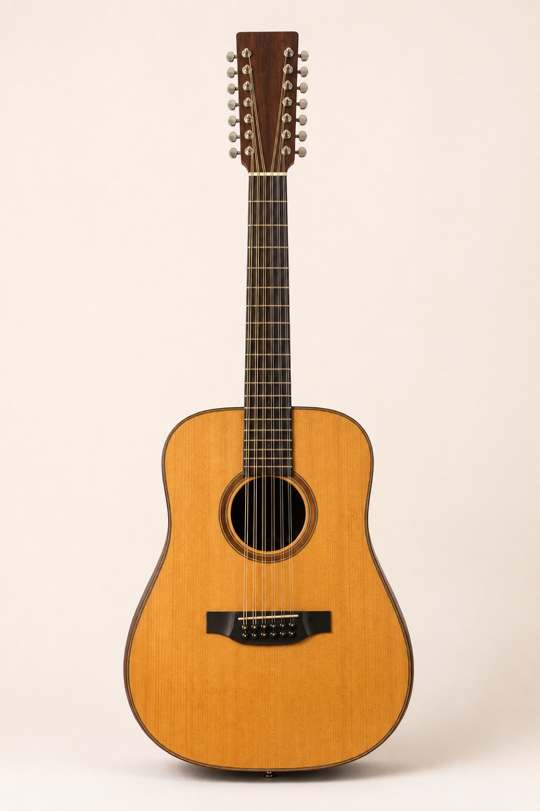 Twelve-string acoustic guitar with paired courses and a wide headstock