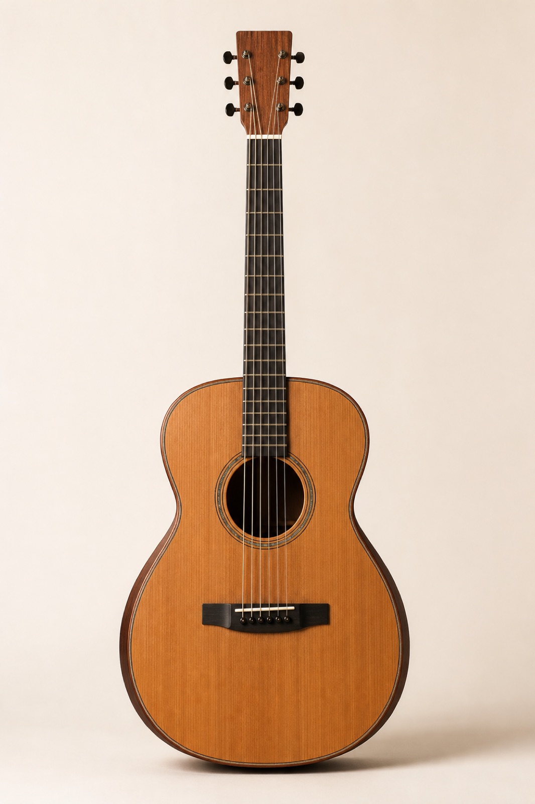Orchestra model acoustic guitar with a western red cedar top