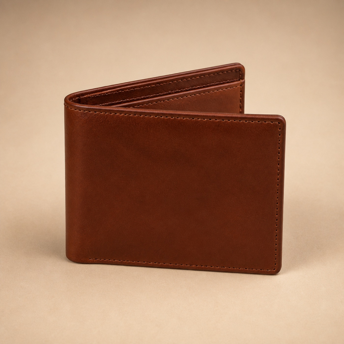 An open bifold leather wallet showing hand-stitched card slots