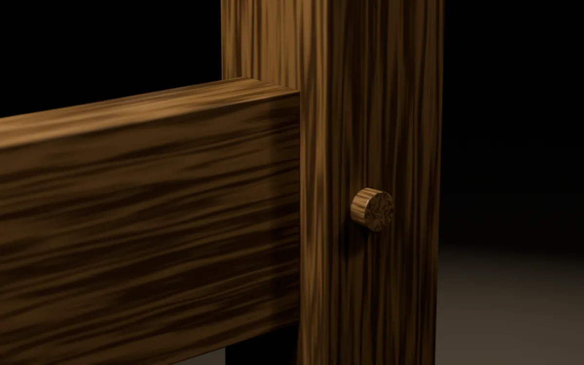 Macro of a finished drawbored joint in white oak with the peg driven flush and the shoulder closed.