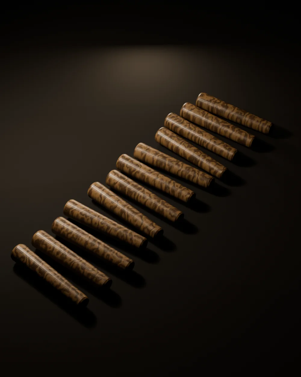 Twelve tapered white oak drawbore pegs laid out in two rows on a dark surface under raking light.
