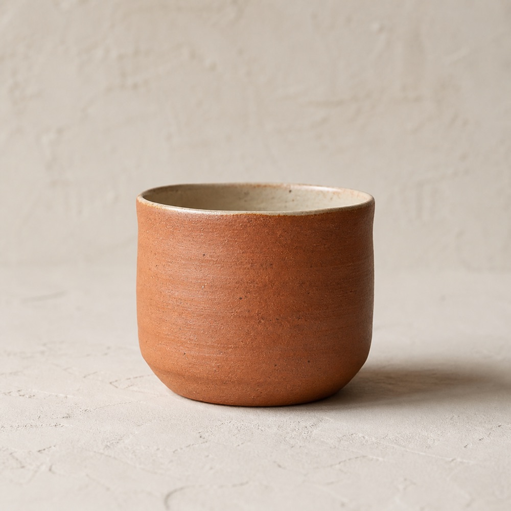 Handleless tea cup in terracotta clay