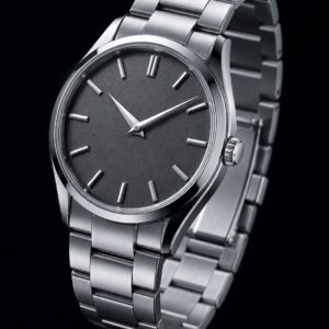 Steel dress watch with a grained slate dial and steel bracelet, three-quarter view on black