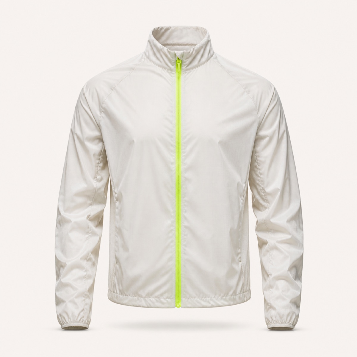 Off-white packable wind shell with a lime full-length zip and a stand collar