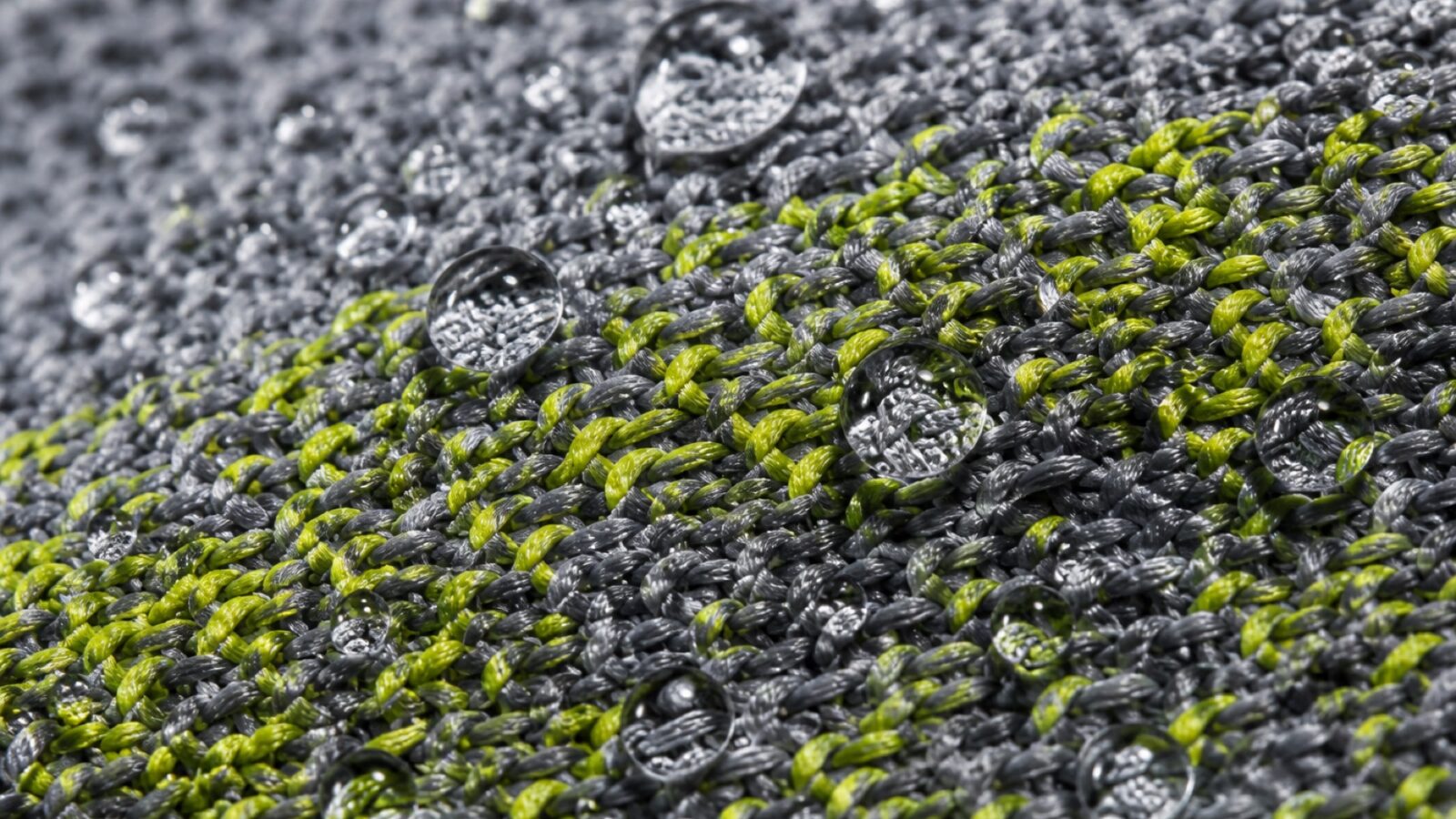 Macro of technical performance fabric with water droplets beading on the surface