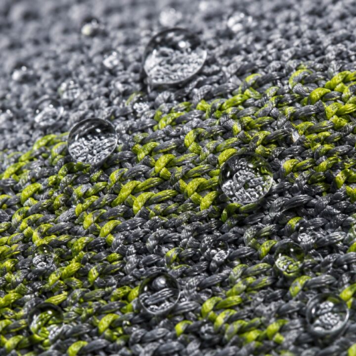 Macro of technical performance fabric with water droplets beading on the surface