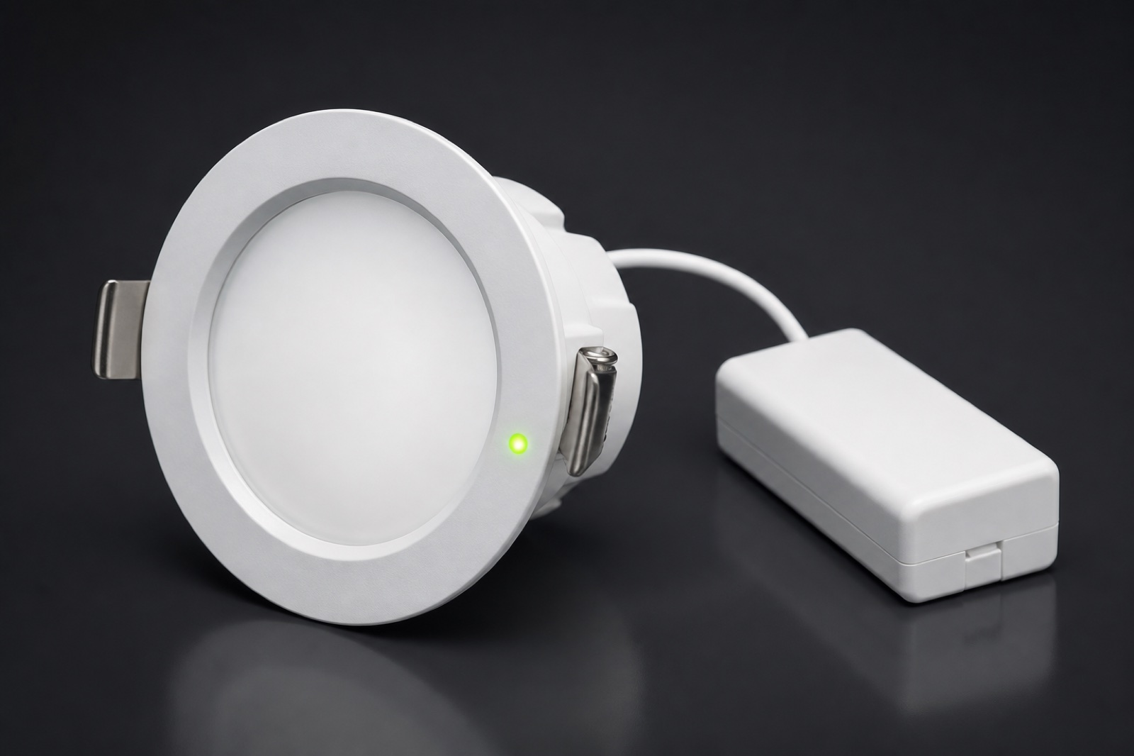 Recessed emergency downlight and charge indicator