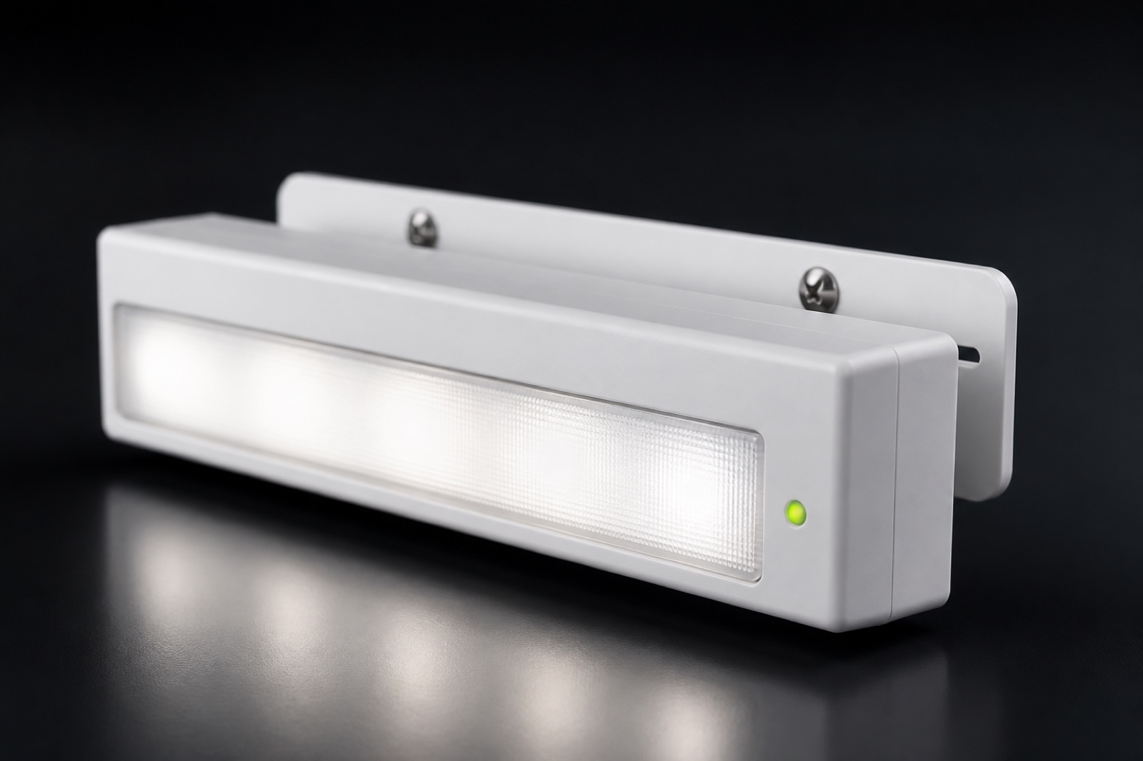 Compact emergency light lens and bracket